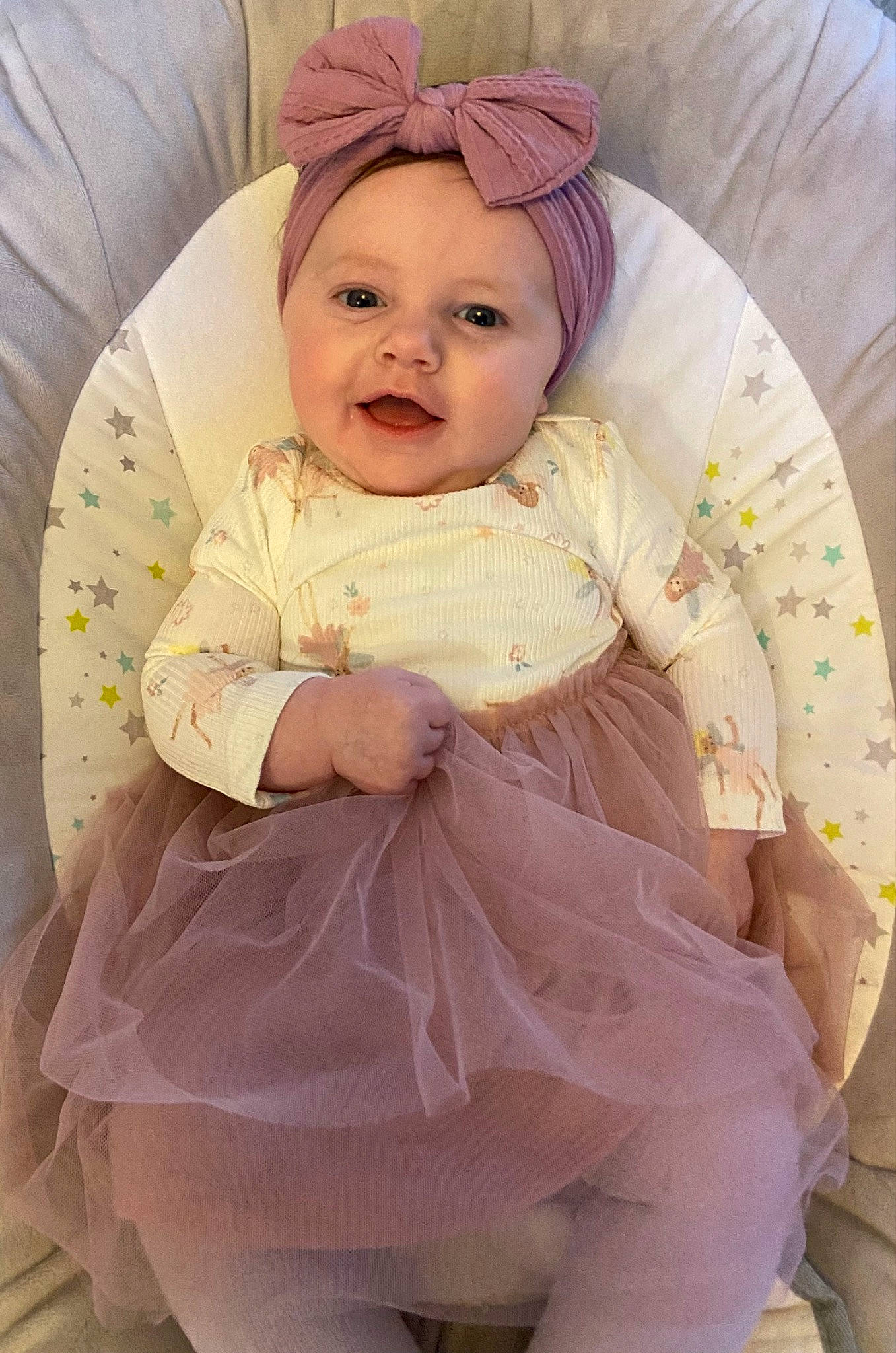 Macey joined the competition — help win amazing prizes! baby, baby_products, baby_toddler_clothing, cap, cheek, child, comfort, embellishment, face, fashion_accessory, happy, headwear, linens, pattern, person, pink, product, sitting, skin, sleeve