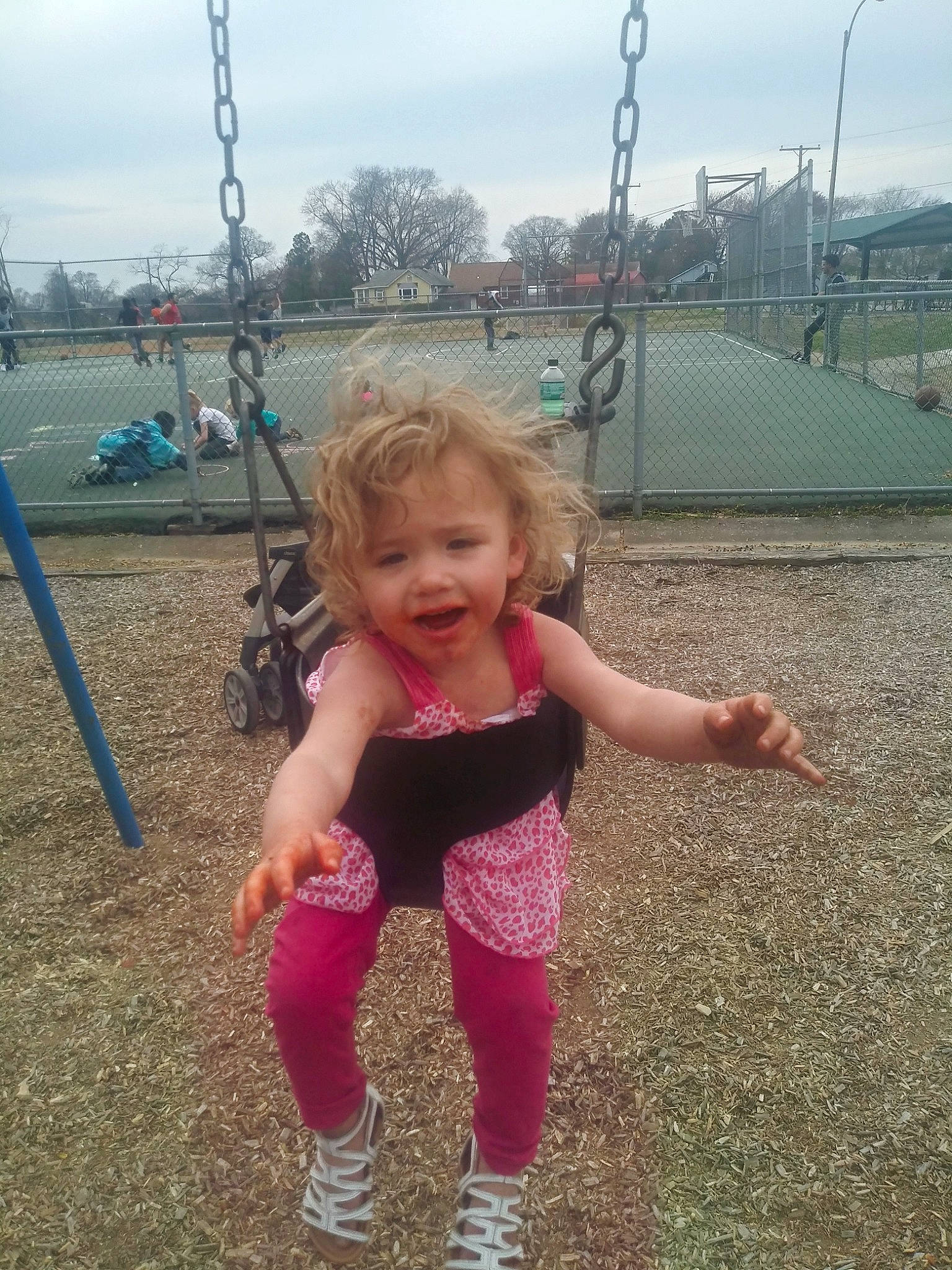 Chloe joined the competition — help win amazing prizes! child, city, fun, happy, human_settlement, leisure, outdoor_play_equipment, person, pink, play, playground, public_space, recreation, sky, smile, summer, swing, toddler, tree, vacation