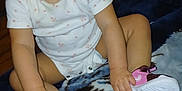 Amoni is registered to the contest to win money with this photo: toddler, child, smiling, sitting, shoes, pink, white, blanket, floor, indoors, cute, happy, person, baby, clothing, hands, face, portrait, infant, curious
