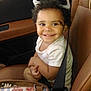 Amoni joined the competition — help win amazing prizes! toddler, child, smile, curly_hair, car_seat, seatbelt, glasses, toy_glasses, bag, floral_pattern, car_interior, leather_seat, happy, sitting, cute, young_child, portrait, casual_clothing, indoor, person