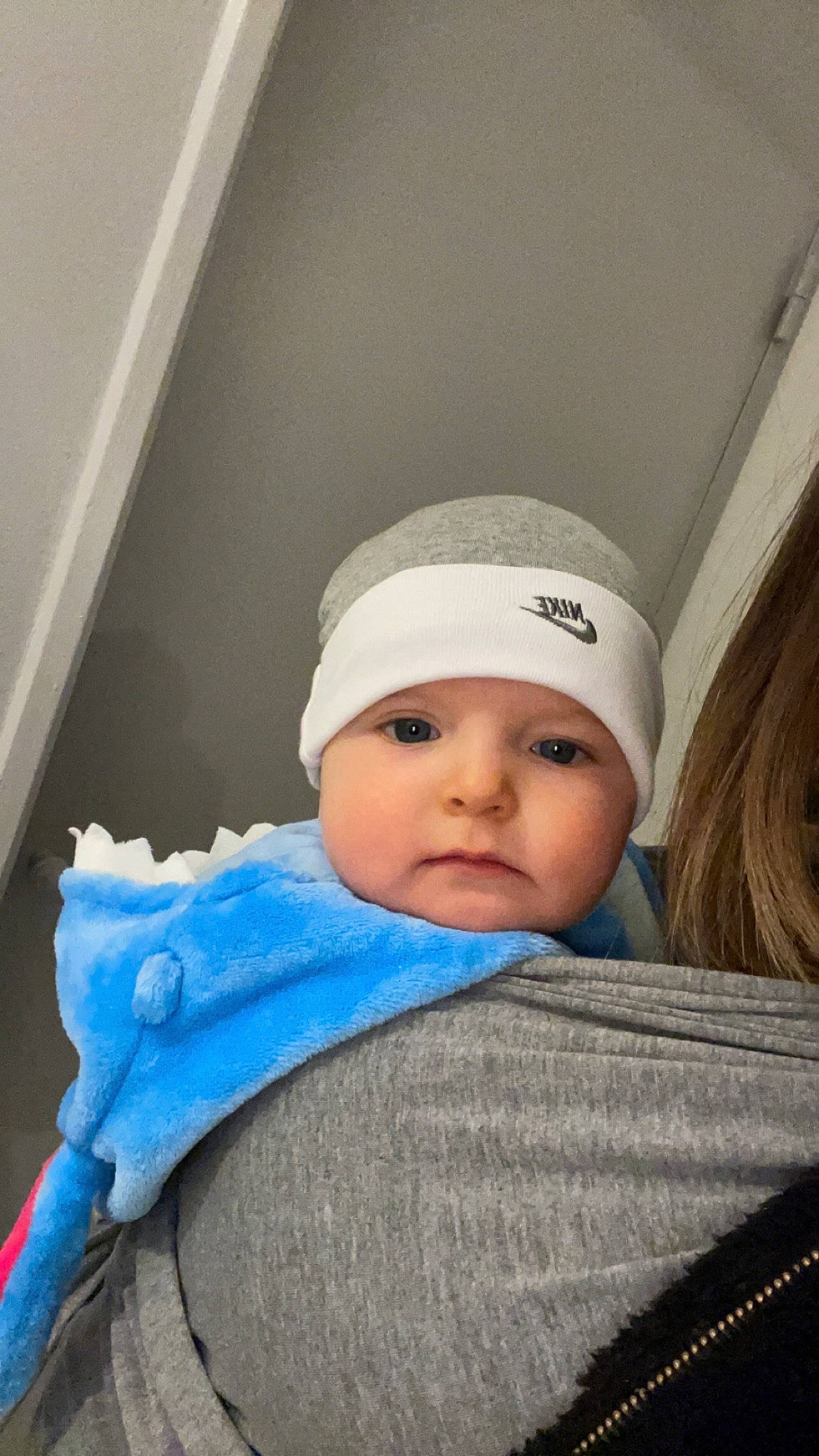 Logan participe au concours pour gagner de l'argent avec cette photo : baby, baby_toddler_clothing, beanie, bonnet, cap, cheek, child, comfort, electric_blue, eyebrow, fashion_accessory, headwear, knit_cap, linens, outerwear, person, portrait_photography, sitting, toddler, winter