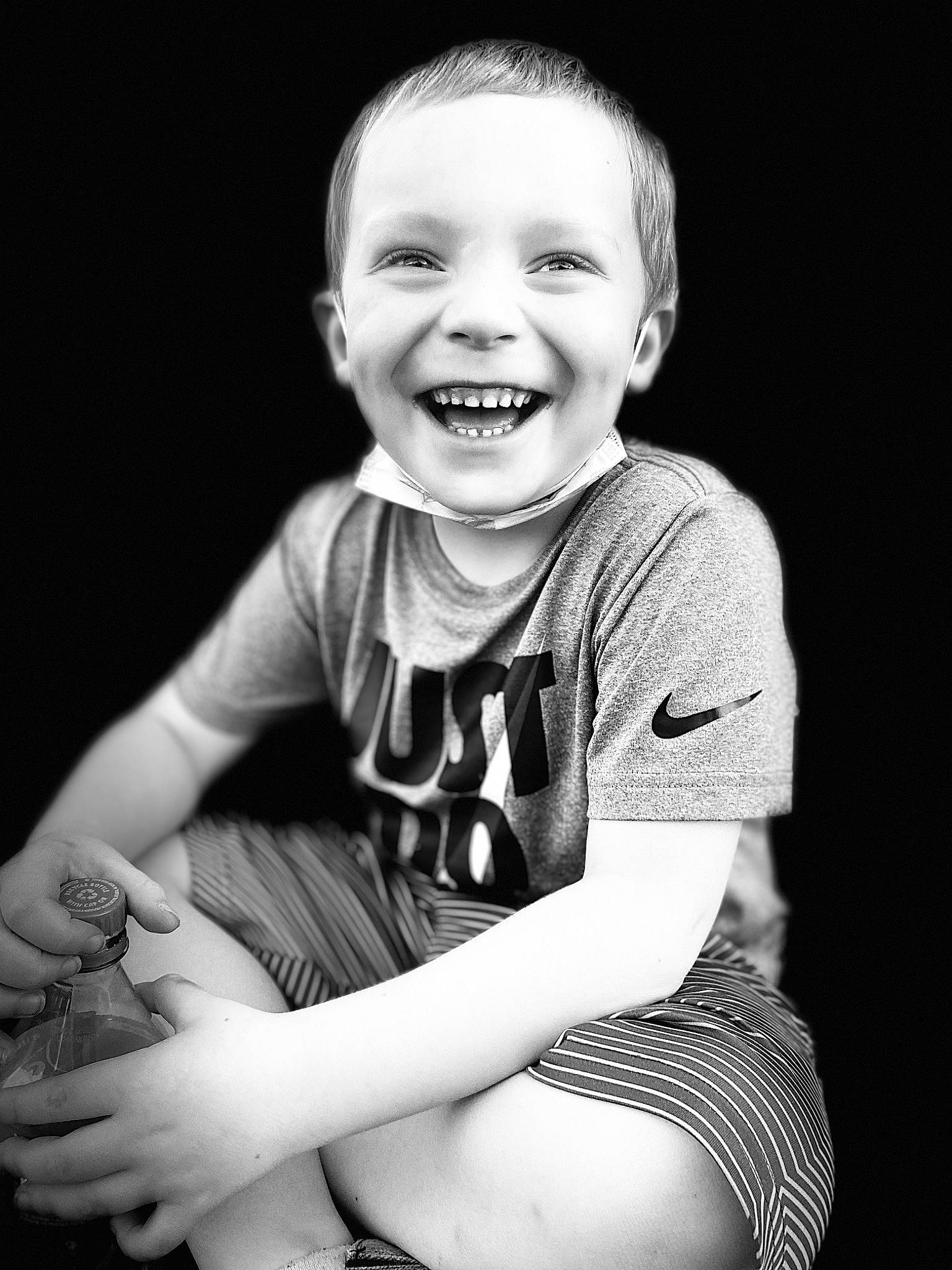 Braxton is registered to the contest to win money with this photo: arm, baby_toddler_clothing, black, black_and_white, cool, elbow, eye, facial_expression, finger, flash_photography, gesture, hand, happy, human_body, joy, leg, person, sleeve, smile, style