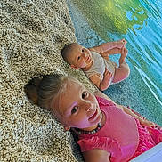 Ethan Et Lena participe au concours pour gagner de l'argent avec cette photo : child, baby, pebble_beach, water, lake, smile, pink_dress, onesie, outdoor, nature, happy, portrait, summer, siblings, relaxing, sunlight, cute, playful, family, vacation