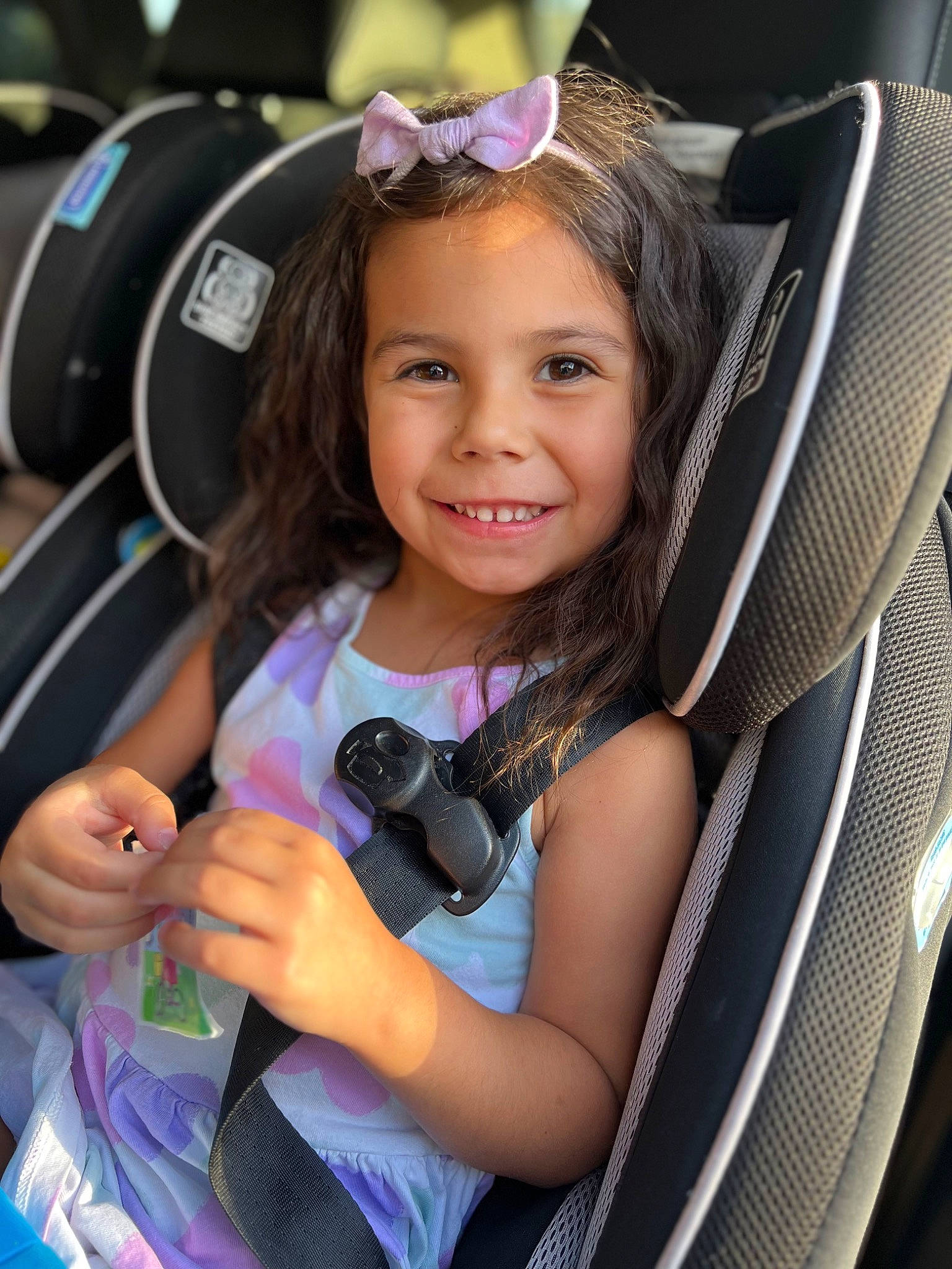 Lina is registered to the contest to win money with this photo: auto_part, baby_carriage, baby_products, baby_toddler_clothing, blond, child, electric_blue, face, facial_expression, fun, goggles, happy, joy, magenta, person, pink, product, purple, skin, smile