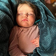 Ophelia is registered to the contest to win money with this photo: baby, sleeping, blanket, pink_clothing, cozy, child, infant, polka_dots, soft_texture, peaceful, portrait, closeup, cute, resting, hands, indoor, warm, comfort, tiny, face