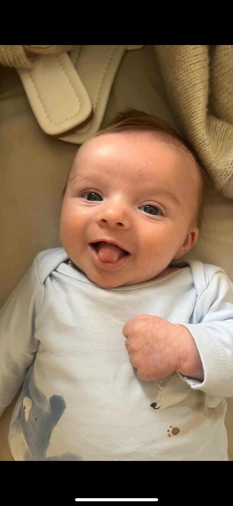 Rudi-Greyson joined the competition — help win amazing prizes! baby, infant, smiling, tongue_out, cute, happy, clothing, knitted_blanket, soft_toys, closeup, portrait, child, young, lying_down, cheeky, cozy, playful, indoors, face, hand