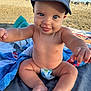 Leeroy participe au concours pour gagner de l'argent avec cette photo : baby, child, blue_eyes, cap, denim, diaper, smiling, beach, sand, towel, sunlight, outdoor, cute, happy, skin, sitting, portrait, infant, playful, summer