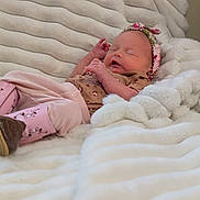 Harley is registered to the contest to win money with this photo: baby, bedding, blanket, boots, cozy, cute, fabric, feet, hand, headband, infant, lying_down, newborn, nursery, peaceful, pink_clothing, portrait, resting, sleeping, soft_texture