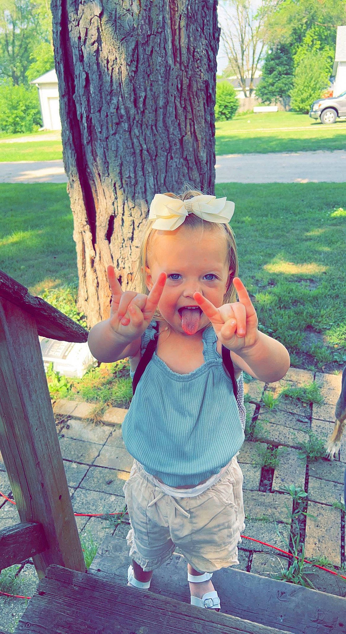 Sophia is registered to the contest to win money with this photo: baby_toddler_clothing, beauty, cool, grass, green, happy, hat, leaf, leisure, morning, people_in_nature, person, photograph, pink, plant, shorts, smile, summer, toddler, tree