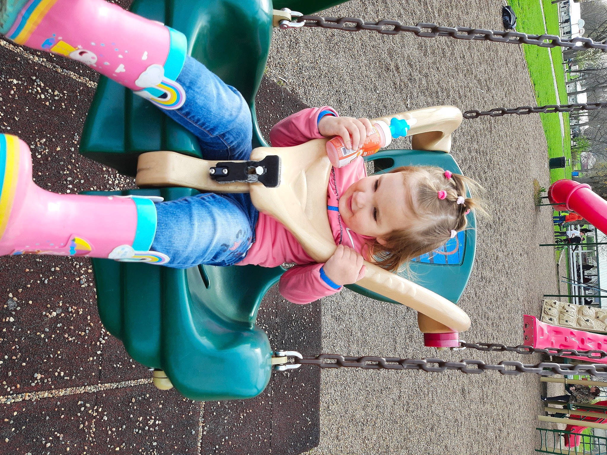 Emma is registered to the contest to win money with this photo: boot, child, electric_blue, fun, green, happy, human_leg, leg, leisure, magenta, person, pink, play, recreation, sandal, shoe, shorts, smile, sneakers, street_fashion