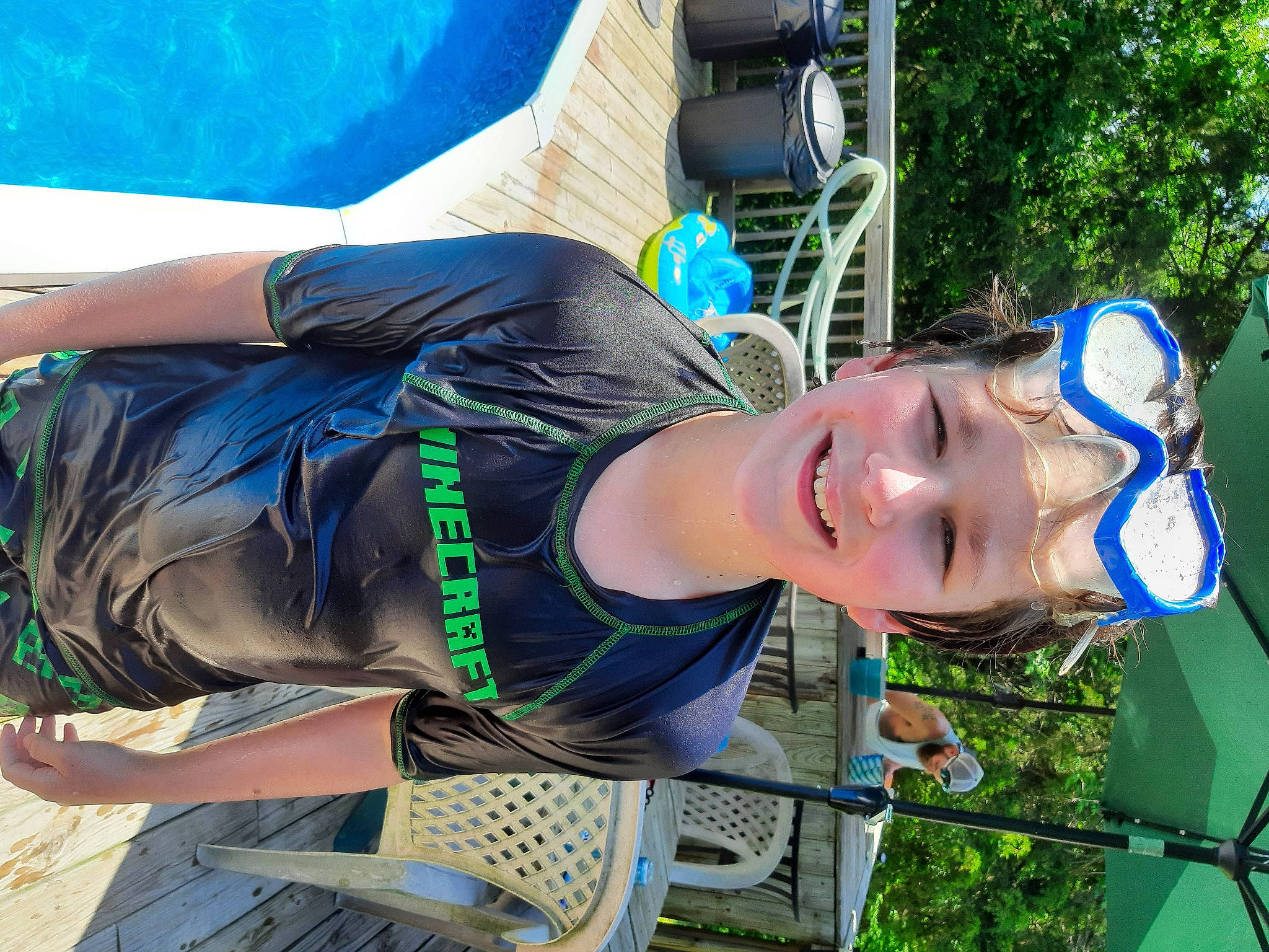 Tyler is registered to the contest to win money with this photo: blue, electric_blue, eyewear, fun, grass, hat, joy, leisure, person, personal_protective_equipment, plant, recreation, shorts, smile, sunglasses, t_shirt, tree, vacation, water