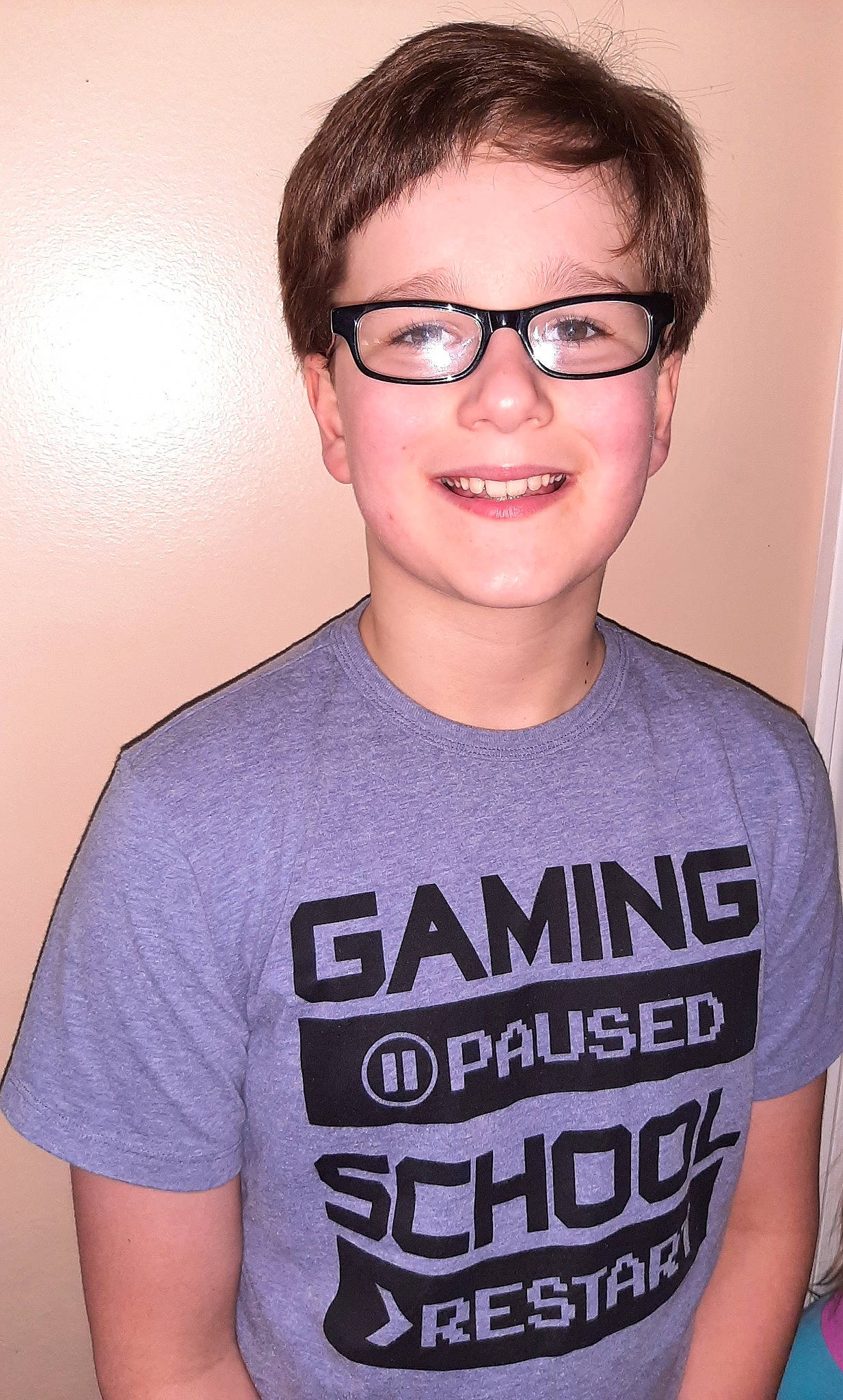 Tyler is registered to the contest to win money with this photo: chin, eyebrow, eyelash, eyewear, forehead, gesture, glasses, happy, head, jaw, joint, joy, lip, mouth, neck, person, shoulder, sleeve, smile, t_shirt