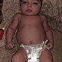 Taylyn is registered to the contest to win money with this photo: baby, infant, diaper, blanket, lying_down, face, skin, arms, legs, fingers, toes, expressionless, indoors, fabric, closeup, newborn, child, person, cute, resting