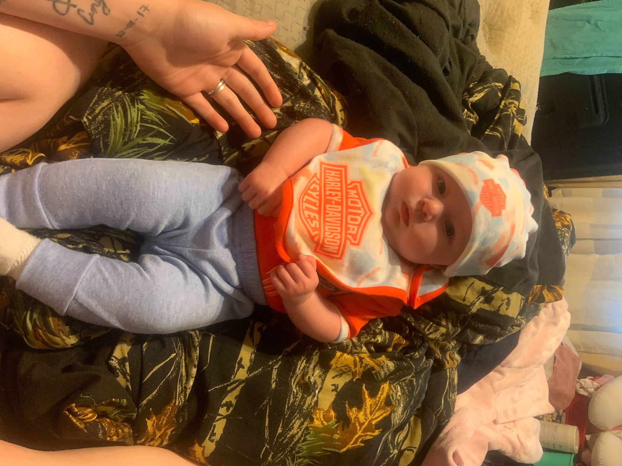 Oaklynn joined the competition — help win amazing prizes! abdomen, baby, baby_toddler_clothing, child, comfort, elbow, facial_expression, gesture, hand, happy, headwear, human_body, leaf, mouth, pattern, person, skin, stomach, thigh, toddler