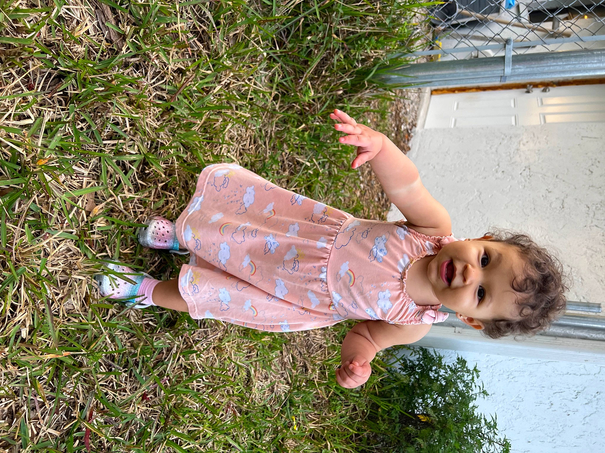 Faye is registered to the contest to win money with this photo: barefoot, child, foot, fun, grass, happy, human_leg, leg, leisure, pattern, people_in_nature, person, plant, sandal, smile, summer, thigh, toddler, water
