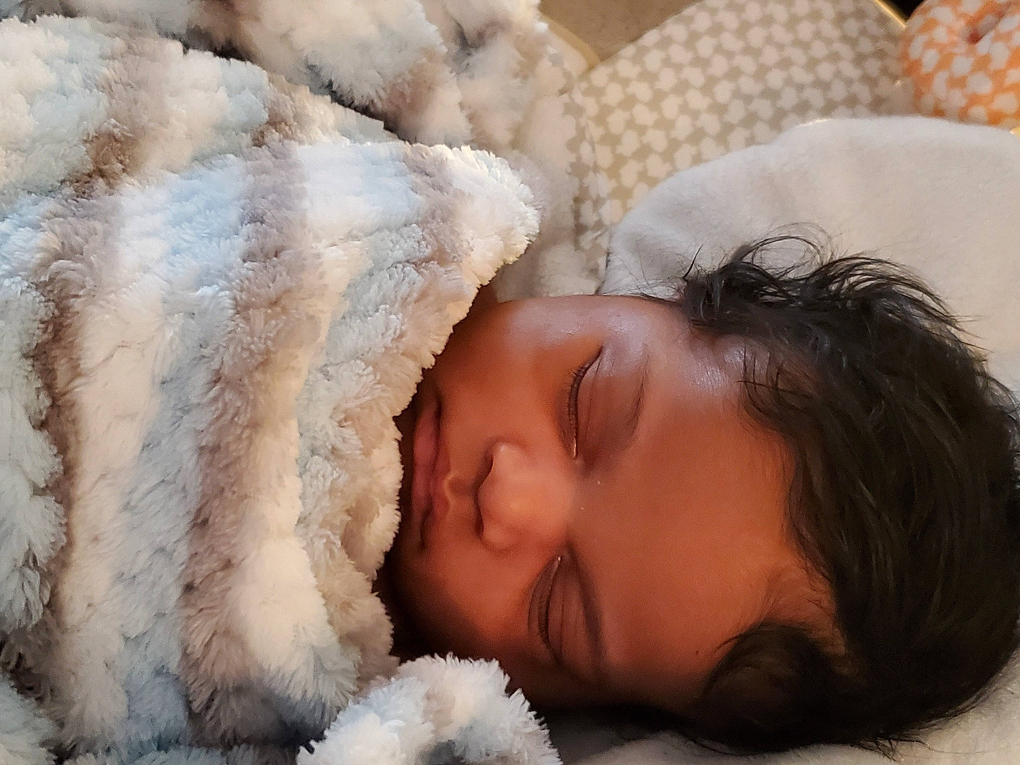 Jalil is registered to the contest to win money with this photo: baby, baby_sleeping, baby_toddler_clothing, bedtime, cheek, comfort, eyelash, face, fur, happy, head, headgear, linens, lip, nap, nose, person, skin, textile, toddler