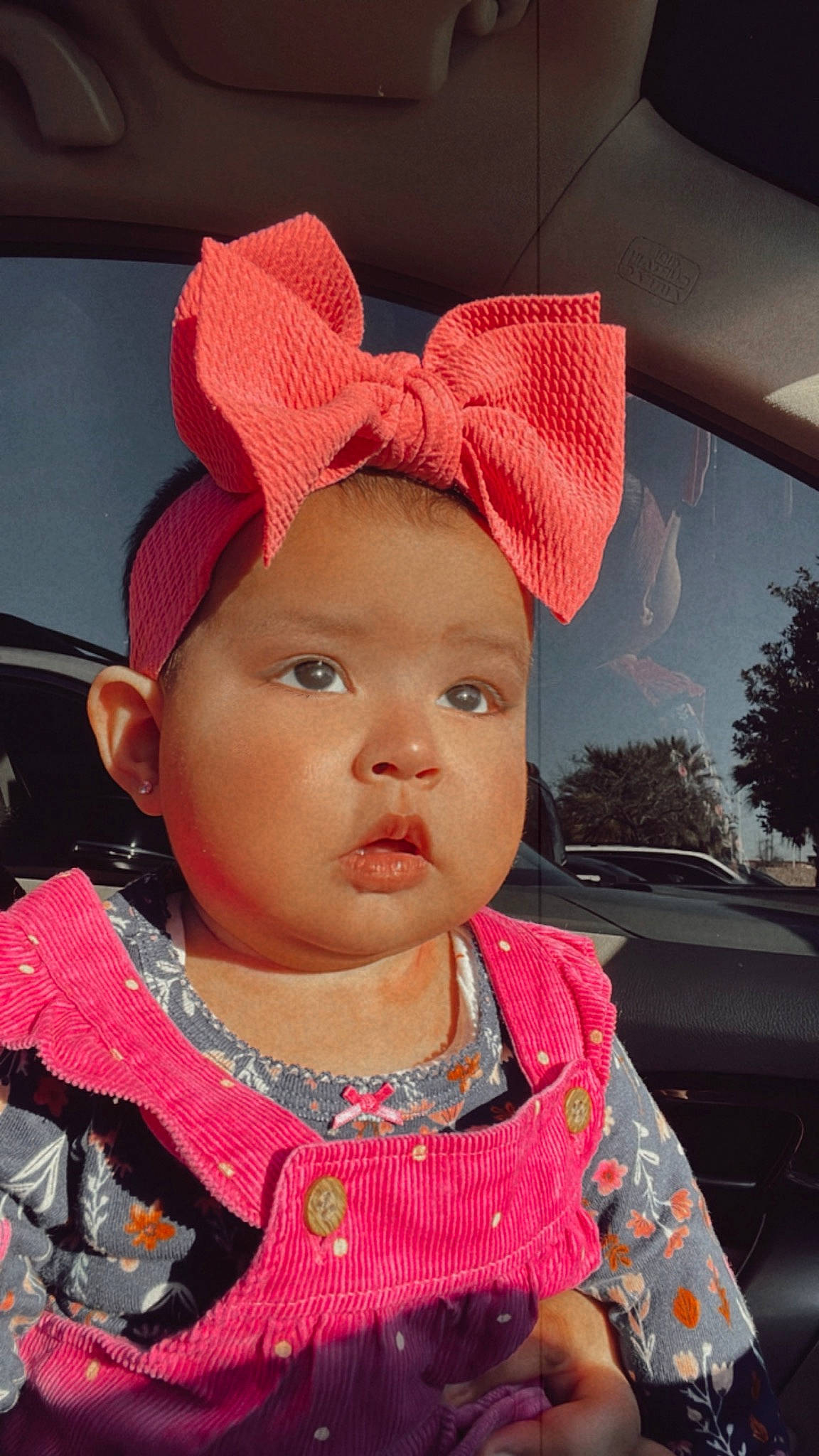 Abigail is registered to the contest to win money with this photo: baby, baby_toddler_clothing, cap, car, cheek, chin, cool, costume_hat, eyelash, happy, headwear, iris, lip, magenta, nose, person, pink, red, skin, sun_hat