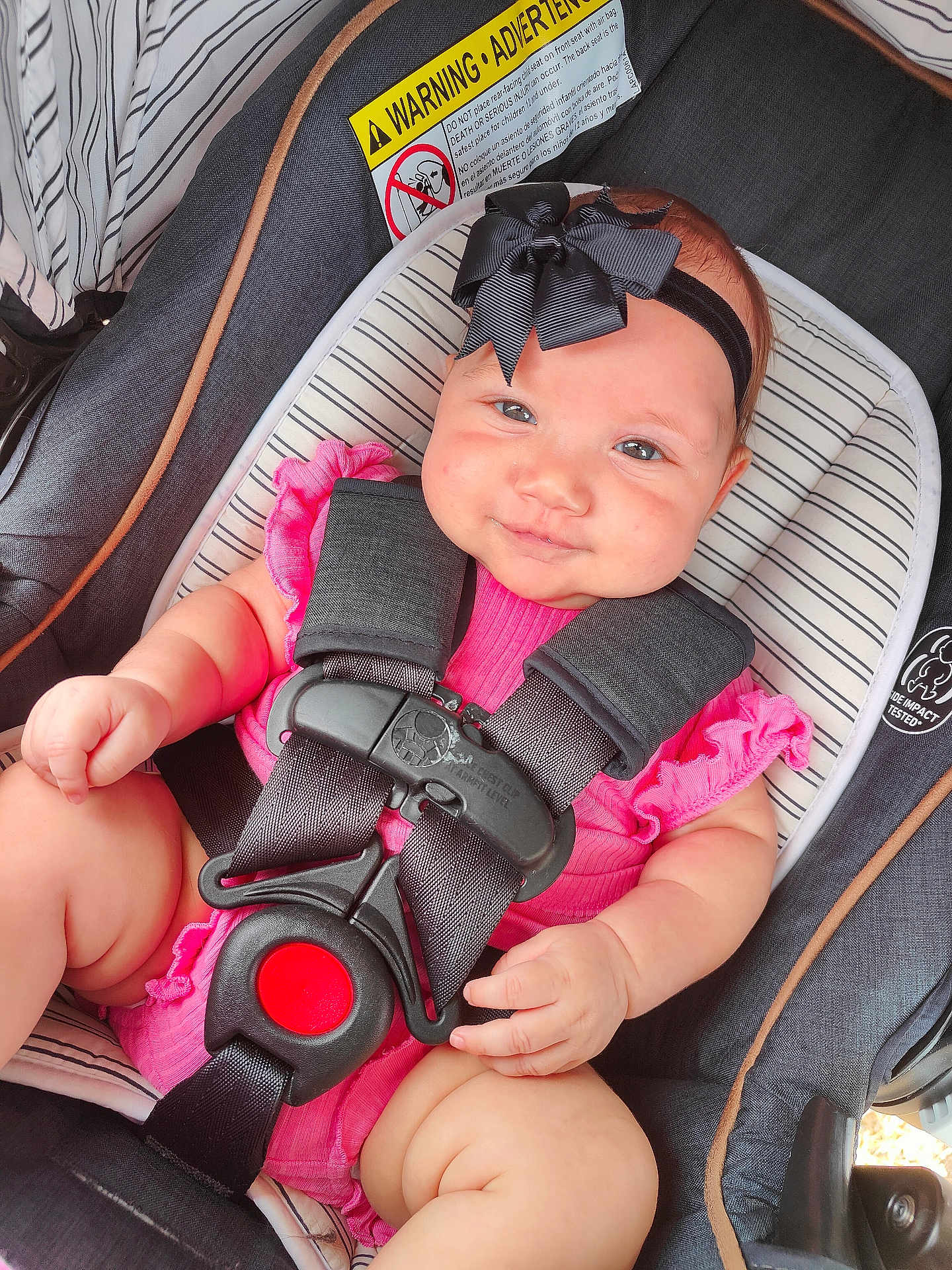 Kingsley joined the competition — help win amazing prizes! baby, child, car_seat, safety_harness, bow_headband, pink_outfit, smile, chubby_cheeks, striped_padding, infant, cute, cute_baby, child_seat, seatbelt, baby_girl, portrait, indoors, closeup, young_child, happy