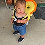 Syrenity joined the competition — help win amazing prizes! toddler, child, backpack, flower, porch, concrete, steps, welcome_sign, shoes, black_shirt, denim_shorts, bag, chair, feet, expression, outdoor, person, sidewalk, sunlight, handbag