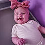 Hannah joined the competition — help win amazing prizes! baby, infant, smiling, headband, pink_bow, purple_wall, white_clothing, happy, cute, portrait, child, indoors, soft_lighting, closeup, person, baby_girl, chubby_cheeks, hand, fashion, toddler