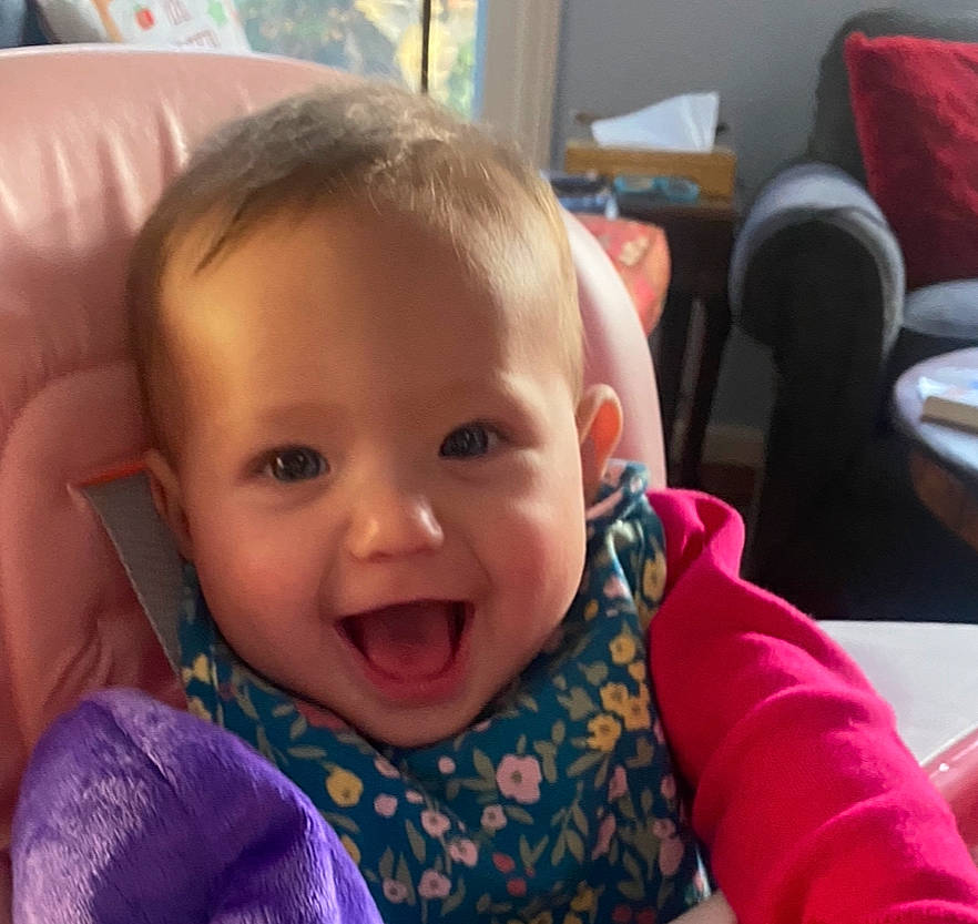 Raquel is registered to the contest to win money with this photo: baby, baby_toddler_clothing, cheek, child, comfort, ear, event, facial_expression, finger, fun, happy, iris, joy, lip, mouth, nose, person, product, sitting, skin