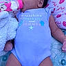 Zendaya joined the competition — help win amazing prizes! baby, infant, bottle, feeding, onesie, blue_clothing, lying_down, blanket, pattern, minnie_mouse, pink, cute, child, indoors, soft_toy, sleepwear, face, hand, legs, young_child