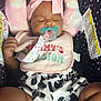 Skylar joined the competition — help win amazing prizes! accessory, baby, bib, car_seat, child, clothing, cute, headband, indoors, infant, newborn, pacifier, patterned_shorts, peaceful, person, pink, polka_dots, resting, sleeping, soft_toys