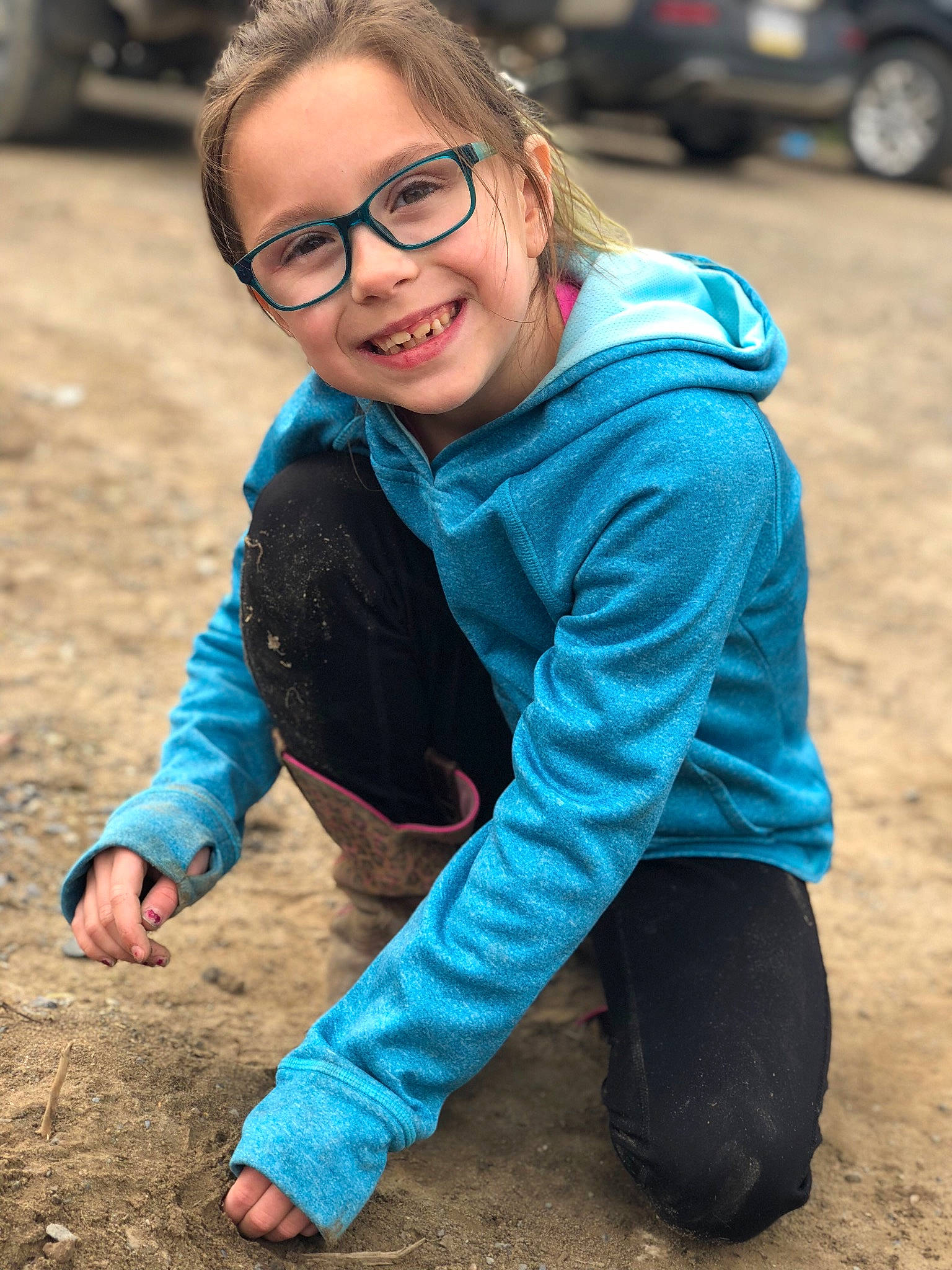 Natalee is registered to the contest to win money with this photo: blue, child, eyewear, fun, glasses, joy, laugh, outerwear, people, person, photography, play, recreation, sitting, smile, soil, toddler, vacation, vehicle, vision_care