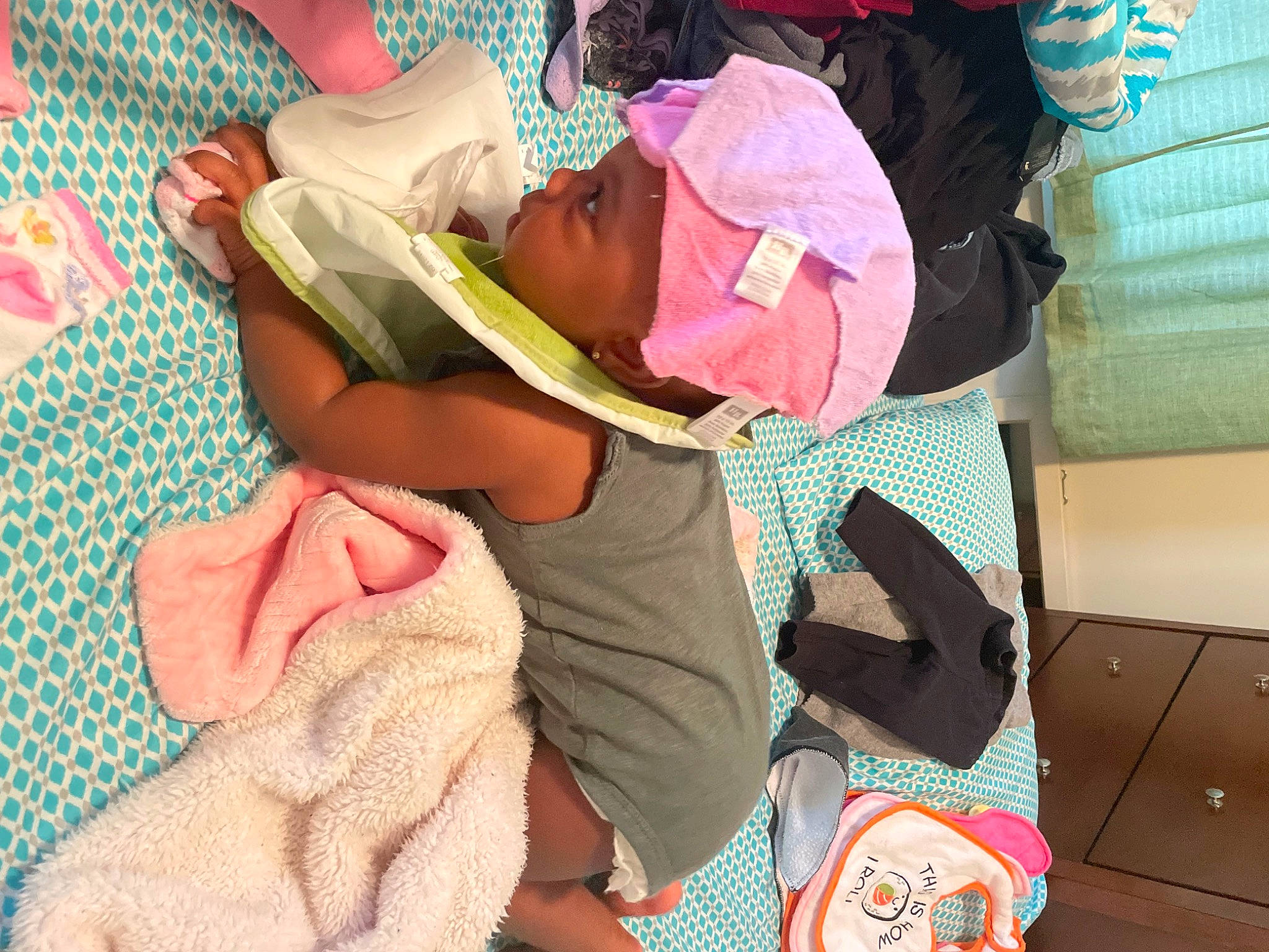 Melanie joined the competition — help win amazing prizes! baby, baby_products, baby_toddler_clothing, bedtime, child, comfort, event, fun, headwear, human_leg, lap, linens, magenta, nap, pattern, person, pink, room, sitting, sleep