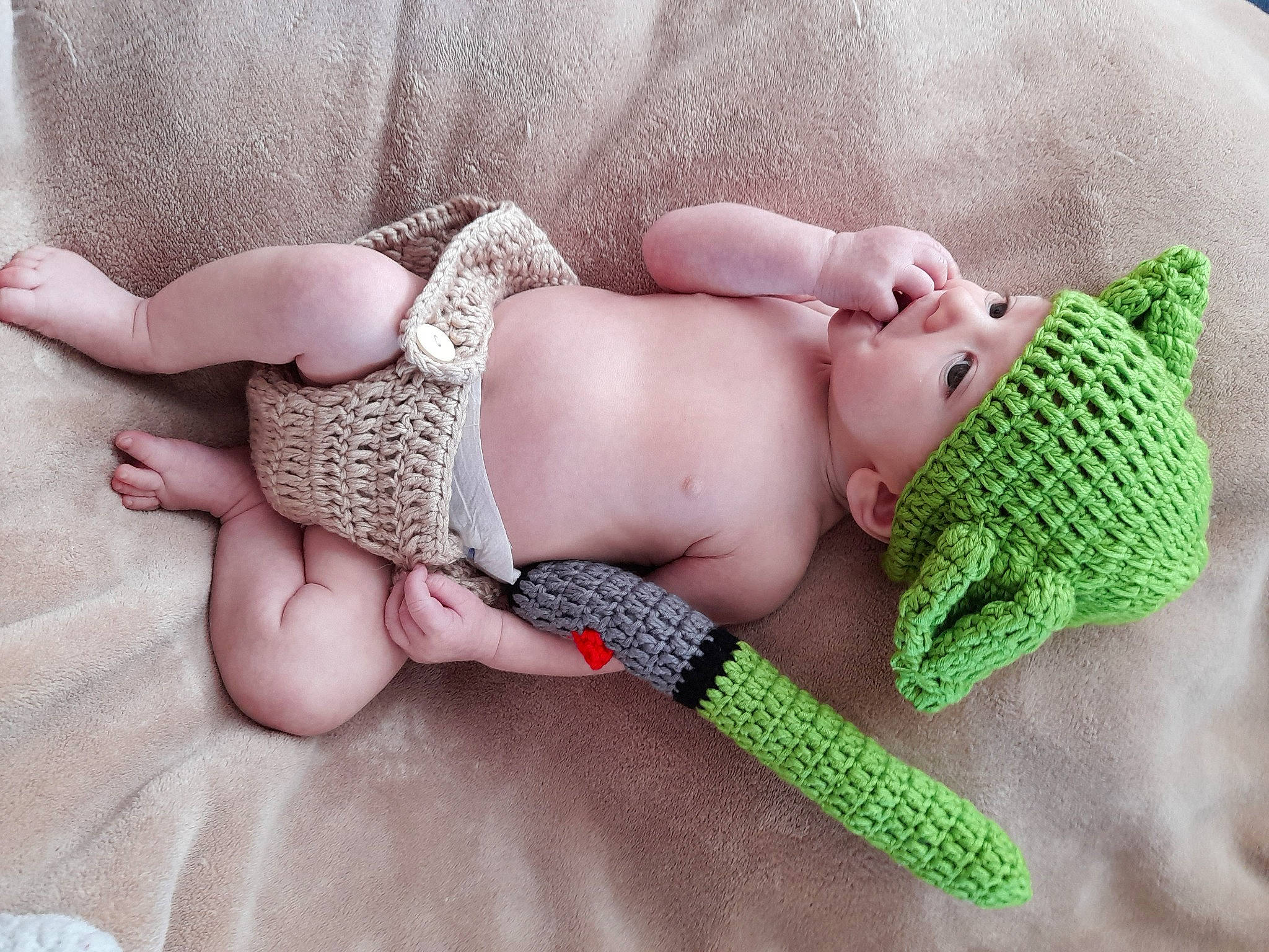 Albert is registered to the contest to win money with this photo: arm, art, baby, baby_sleeping, chest, comfort, finger, hand, headwear, human_body, joint, leg, nail, pattern, person, skin, textile, thigh, thumb, toddler