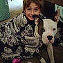 Helena joined the competition — help win amazing prizes! child, dog, blanket, indoor, carpet, smiling, brown_hair, pitbull, patterned_blanket, ears, face, paw, furniture, toy, floor, cute, happy, pet, friendship, cozy