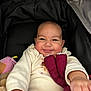 Adélina participe au concours pour gagner de l'argent avec cette photo : baby, infant, smiling, stroller, car_seat, plush_toy, blanket, cozy, cheeks, portrait, hand, onesie, clothing, canopy, indoors, cute, close_up, happy, seat, adorable