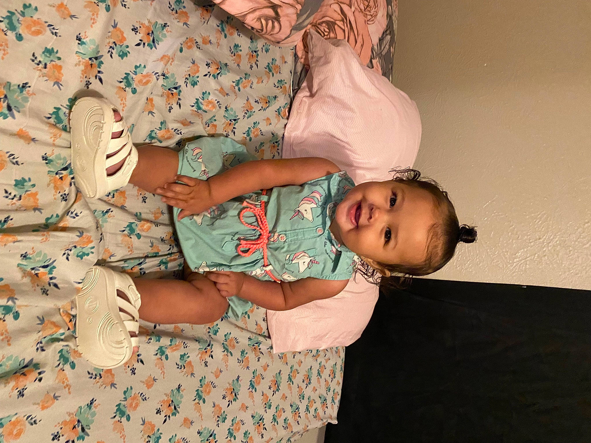 Riley joined the competition — help win amazing prizes! baby, baby_toddler_clothing, child, comfort, dress, glasses, happy, human_body, joy, leg, linens, pattern, peach, person, pink, room, sitting, sleeve, smile, toddler