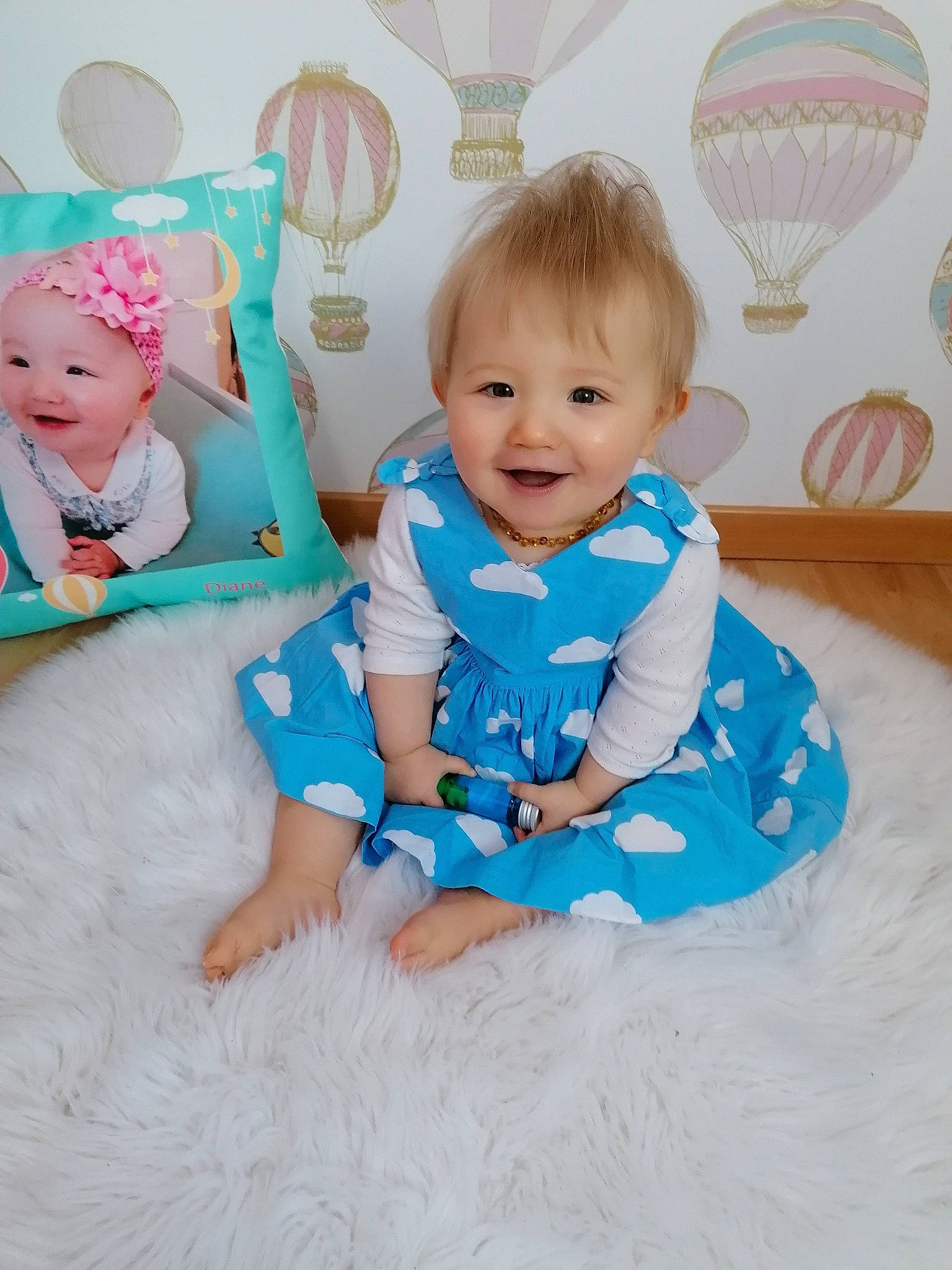 Diane participe au concours pour gagner de l'argent avec cette photo : aerostat, aqua, azure, baby, baby_toddler_clothing, comfort, dress, happy, head, headwear, human_body, joy, person, photograph, pink, purple, skin, sleeve, smile, t_shirt