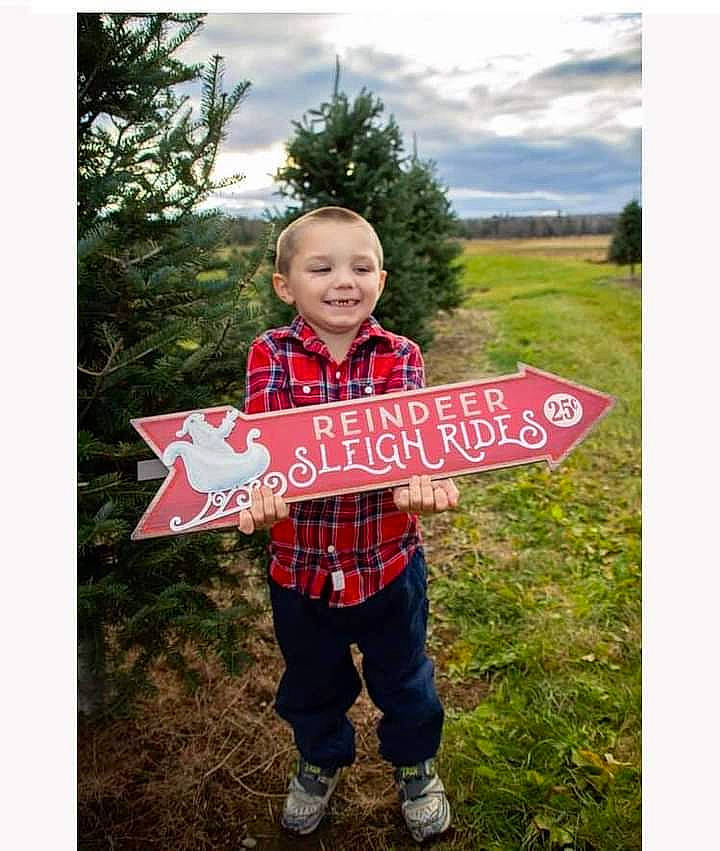 Brody is registered to the contest to win money with this photo: cloud, event, font, grass, grassland, handwriting, happy, holiday, joy, landscape, leaf, pattern, people_in_nature, person, plaid, plant, sky, sleeve, smile, t_shirt
