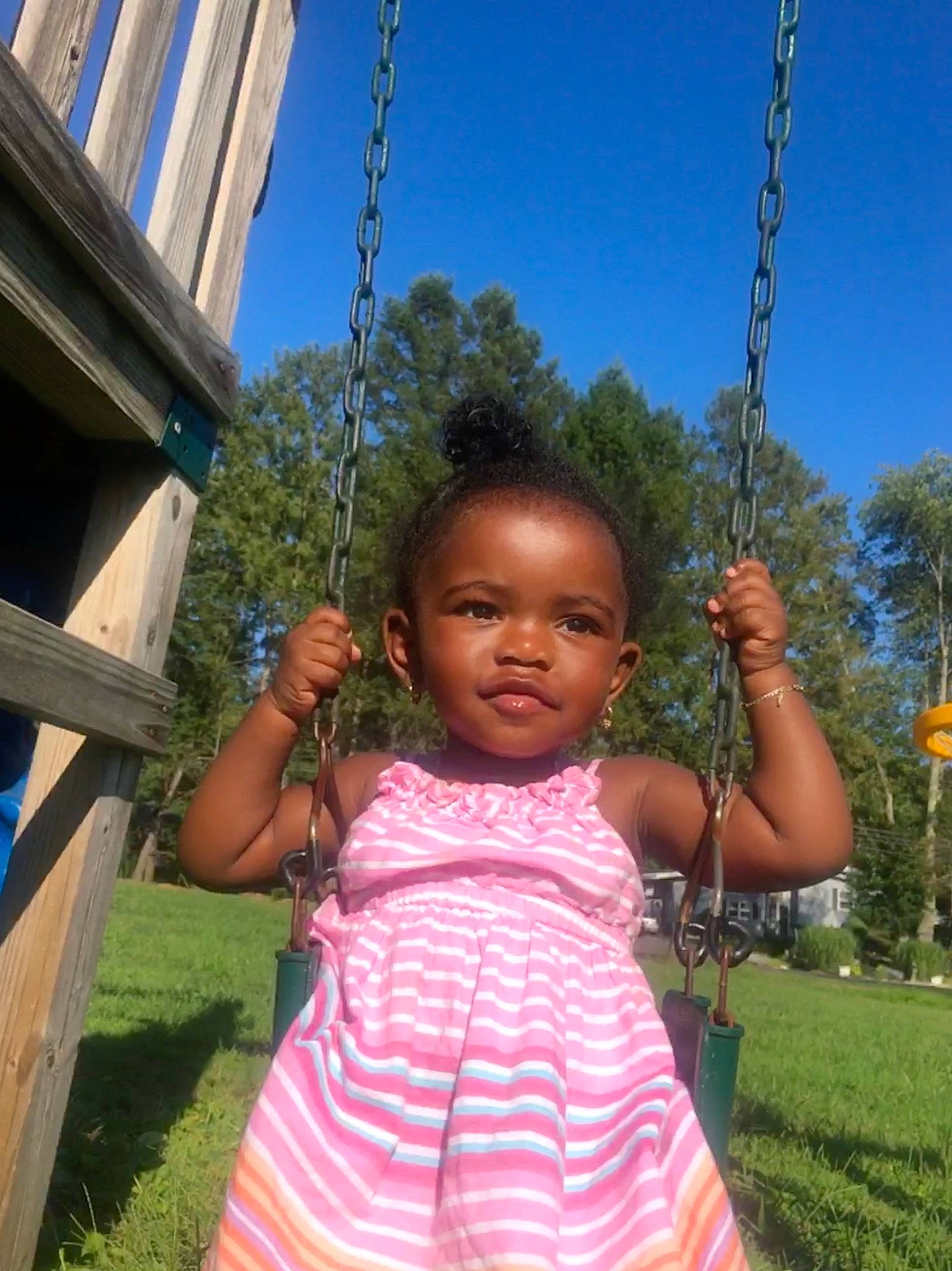 Kaedyn joined the competition — help win amazing prizes! baby, child, fun, grass, happy, leisure, outdoor_play_equipment, people, person, pink, plant, play, playground, public_space, smile, summer, swing, toddler, tree, vacation