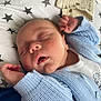 Lenny joined the competition — help win amazing prizes! baby, blanket, blue_sweater, closed_eyes, cozy, cute, face, hand, indoors, infant, knitted, mouth_open, newborn, peaceful, pillow, resting, skin, sleeping, soft_texture, star_pattern
