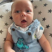 Lenny joined the competition — help win amazing prizes! baby, cartoon, child, clothing, cute, expression, eyes, face, hand, indoors, infant, monster, overall, pattern, pillow, portrait, skin, soft, stars, young