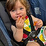 baby, blue_eyes, car_seat, cheesy_crackers, child, colorful_clothing, crumbs, cute, face, hair, hand, happy, indoor, messy, portrait, seatbelt, sitting, snack, straps, toddler