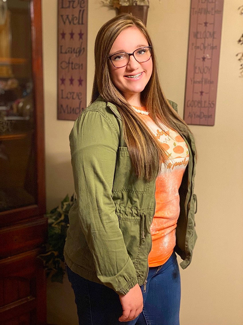 Kaleigh joined the competition — help win amazing prizes! blond, clothing, eyewear, glasses, hair, happy, head, joint, joy, layered_hair, long_hair, organ, person, picture_frame, shoulder, sleeve, smile, standing, trunk, vision_care