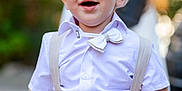 édouard a rejoint le concours — aidez-le/la à gagner de superbes lots ! toddler, child, boy, smiling, happy, outdoor, suspenders, bow_tie, hat, cap, white_shirt, fashion, portrait, cute, face, person, young_child, clothing, daylight, background_blur