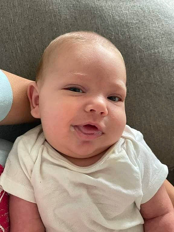 Stetson is registered to the contest to win money with this photo: baby, baby_toddler_clothing, blond, cheek, comfort, ear, eye, eyebrow, eyelash, happy, iris, lip, mouth, neck, nose, person, sitting, skin, sleeve, smile