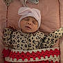 Zeniyah joined the competition — help win amazing prizes! baby, sleeping, infant, pink_hat, bow, leopard_print, onesie, blanket, crocheted_blanket, red_blanket, white_blanket, soft_cushion, pink_cushion, pacifier, sleep, cozy, cute, child, face, hand