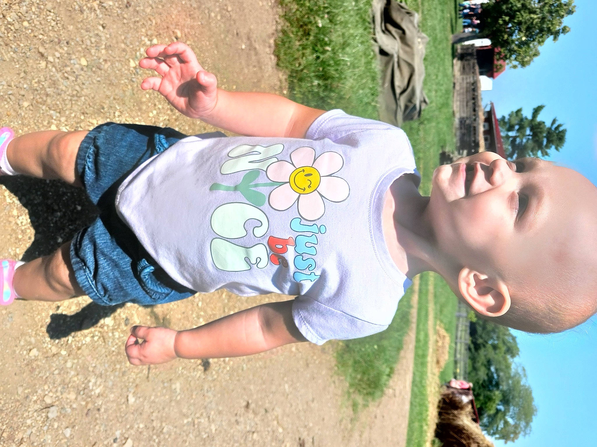 Aleah joined the competition — help win amazing prizes! arm, child, cool, eyewear, facial_expression, finger, fun, grass, hand, happy, human_body, joint, leisure, people_in_nature, person, plant, recreation, sky, t_shirt, toddler