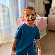 Marley a rejoint le concours — aidez-le/la à gagner de superbes lots ! child, face_paint, smiling, blue_shirt, indoor, crib, nursery, curtains, window, hardwood_floor, playful, portrait, toddler, happy, boy, clothing, expression, eyes, teeth, sneakers