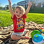 toddler, child, outdoor, grass, blanket, toy, red_shirt, happy, smiling, sunlight, playful, cute, sitting, arms_up, daylight, nature, person, young_child, summer, fun