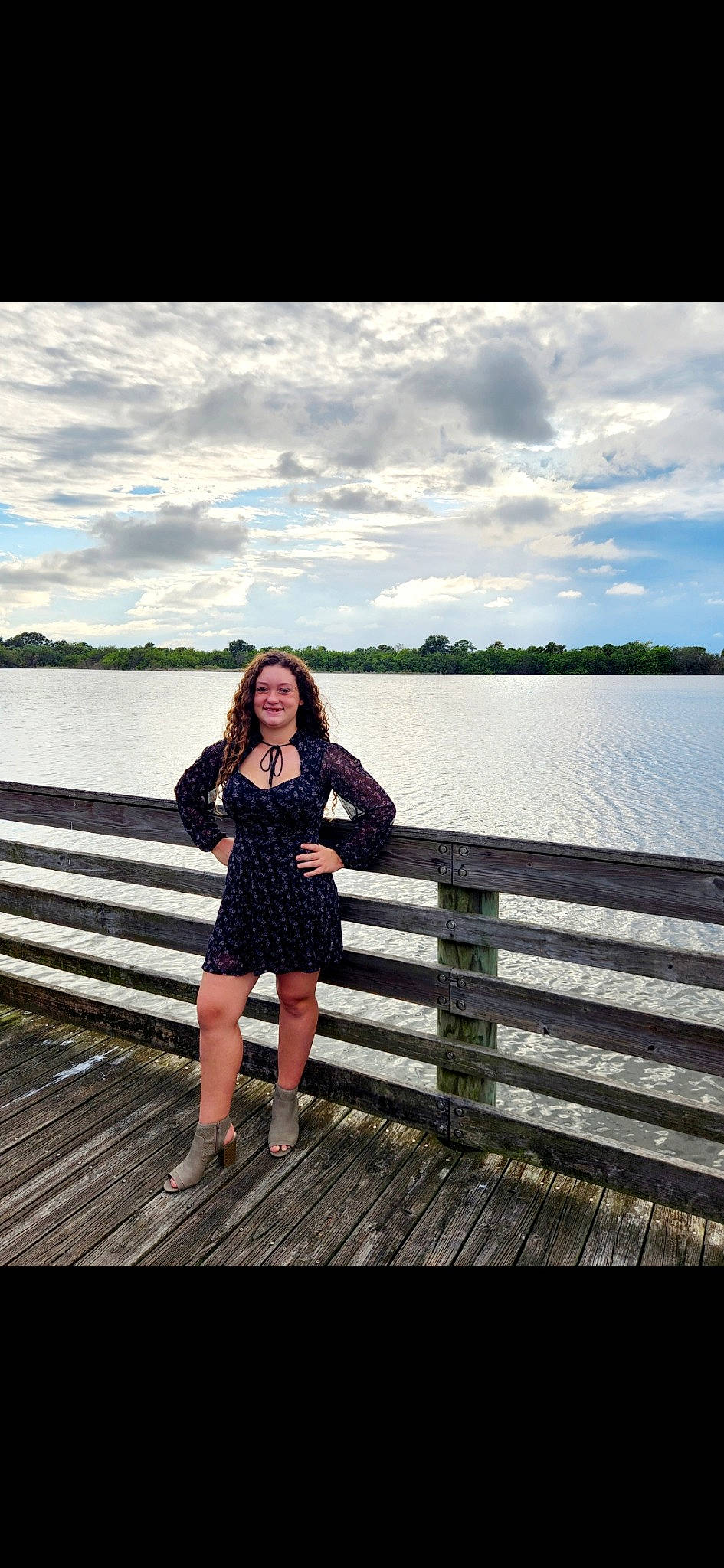 Kahlia is registered to the contest to win money with this photo: bank, bridge, cloud, dock, flash_photography, happy, horizon, human_leg, joy, lake, landscape, leg, leisure, pattern, people_in_nature, person, pier, sky, travel, tree