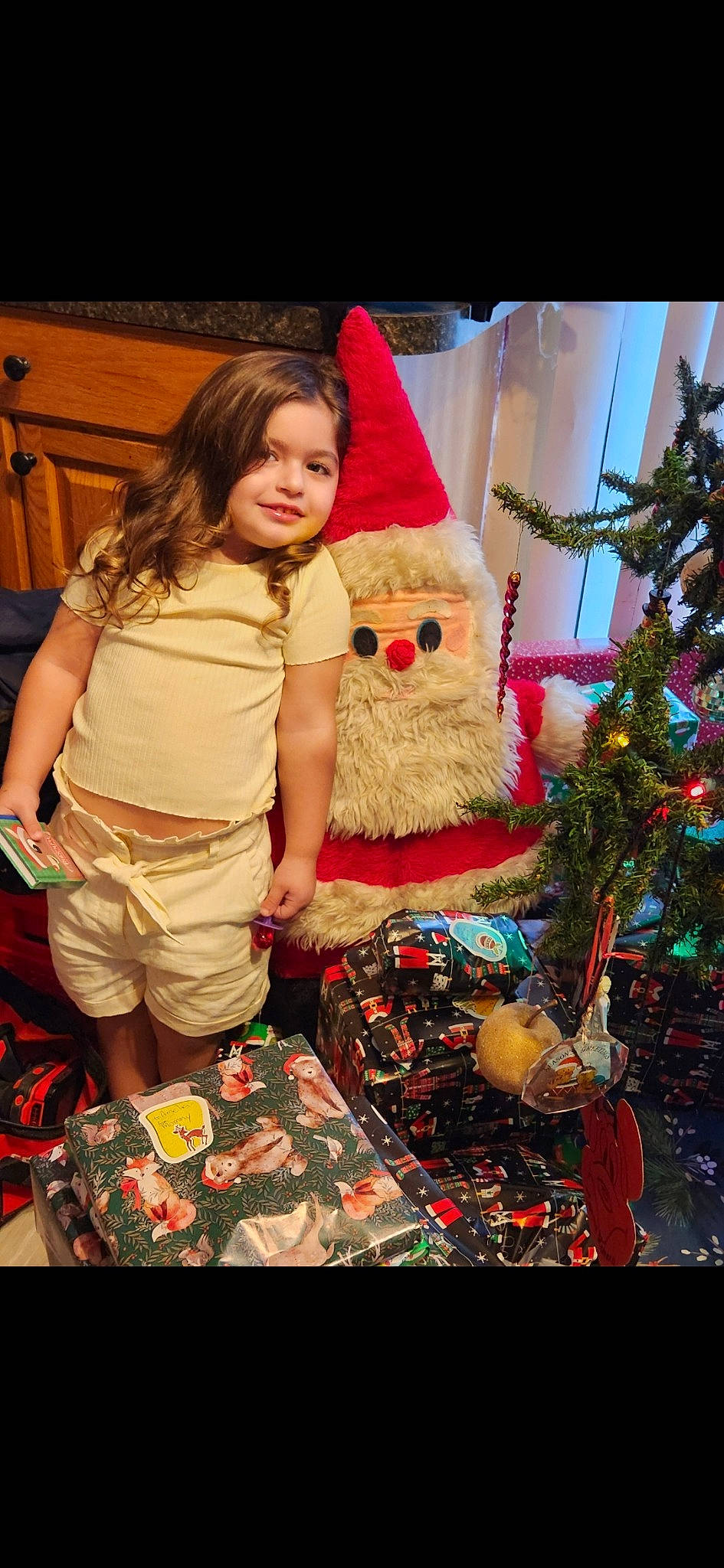Amelia joined the competition — help win amazing prizes! christmas, christmas_decoration, christmas_eve, christmas_ornament, christmas_tree, conifer, event, evergreen, fun, happy, hat, holiday, holiday_ornament, interior_design, joy, lap, ornament, person, toddler, toy