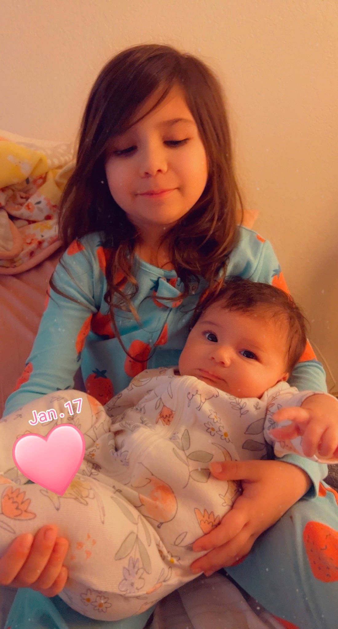 Emberly is registered to the contest to win money with this photo: arm, baby, baby_toddler_clothing, balloon, cheek, child, event, finger, happy, holiday, iris, lap, nail, organ, person, pink, sharing, sitting, skin, smile