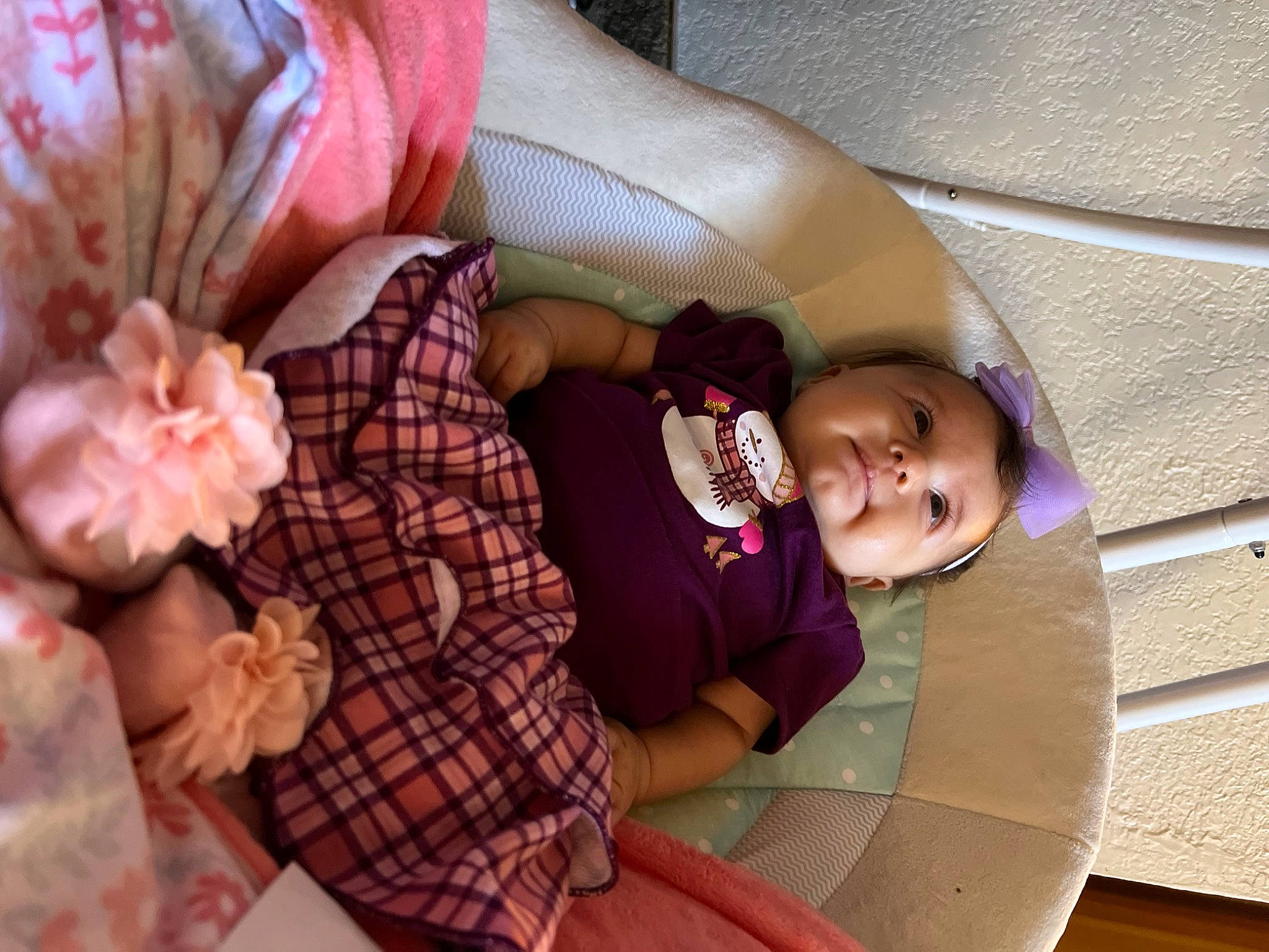 Anna is registered to the contest to win money with this photo: baby_products, child, comfort, couch, finger, hand, leisure, linens, nail, pattern, person, pink, plaid, room, sitting, skin, tartan, textile, thigh, toddler